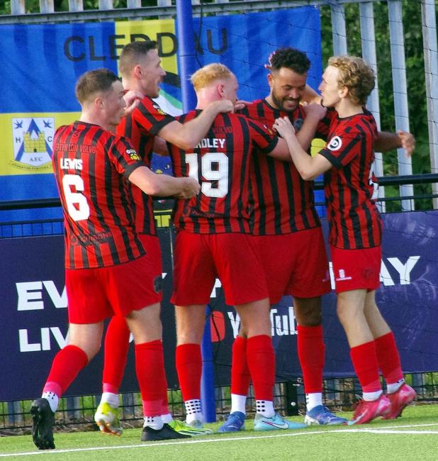 Caernarfon Town celebrate grabbing a second half equaliser. Picture Gordon Thomas